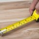 The experts at Hollis Flooring measuring wooden flooring